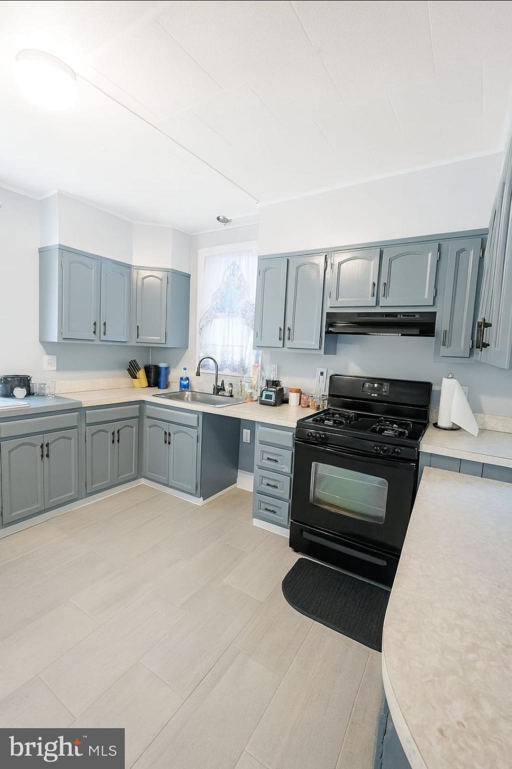 2622 Perkiomen Avenue Reading, PA 19606 - Photo 6 of 27 a kitchen with a sink a stove and cabinets