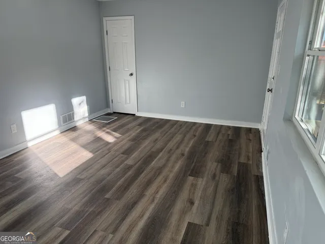 a view of a livingroom with wooden floor