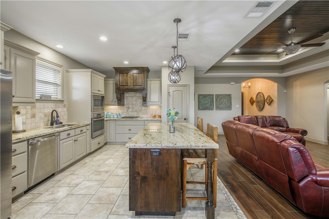 3049 Embers Loop Bryan, TX 77808 - Photo 11 of 21 a large kitchen with kitchen island granite countertop lots of counter top space