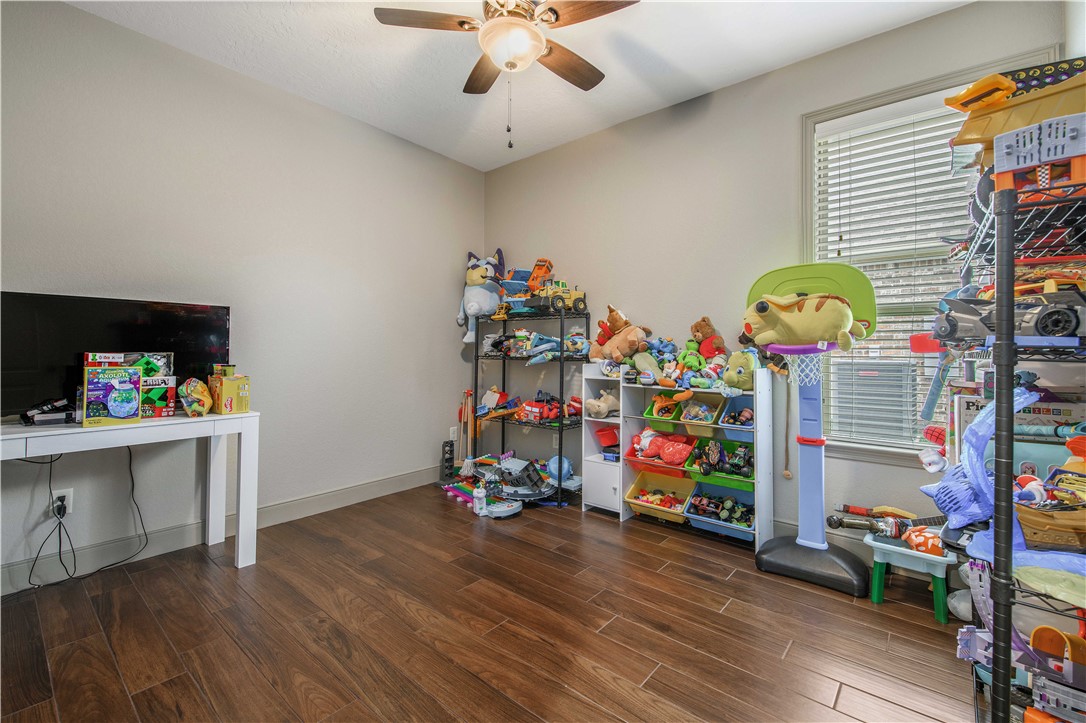 3049 Embers Loop Bryan, TX 77808 - Photo 18 of 21 a view of play room with toys and wooden floor
