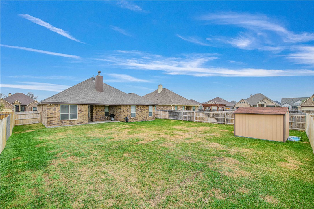 3049 Embers Loop Bryan, TX 77808 - Photo 21 of 21 a view of a house with a yard and roof
