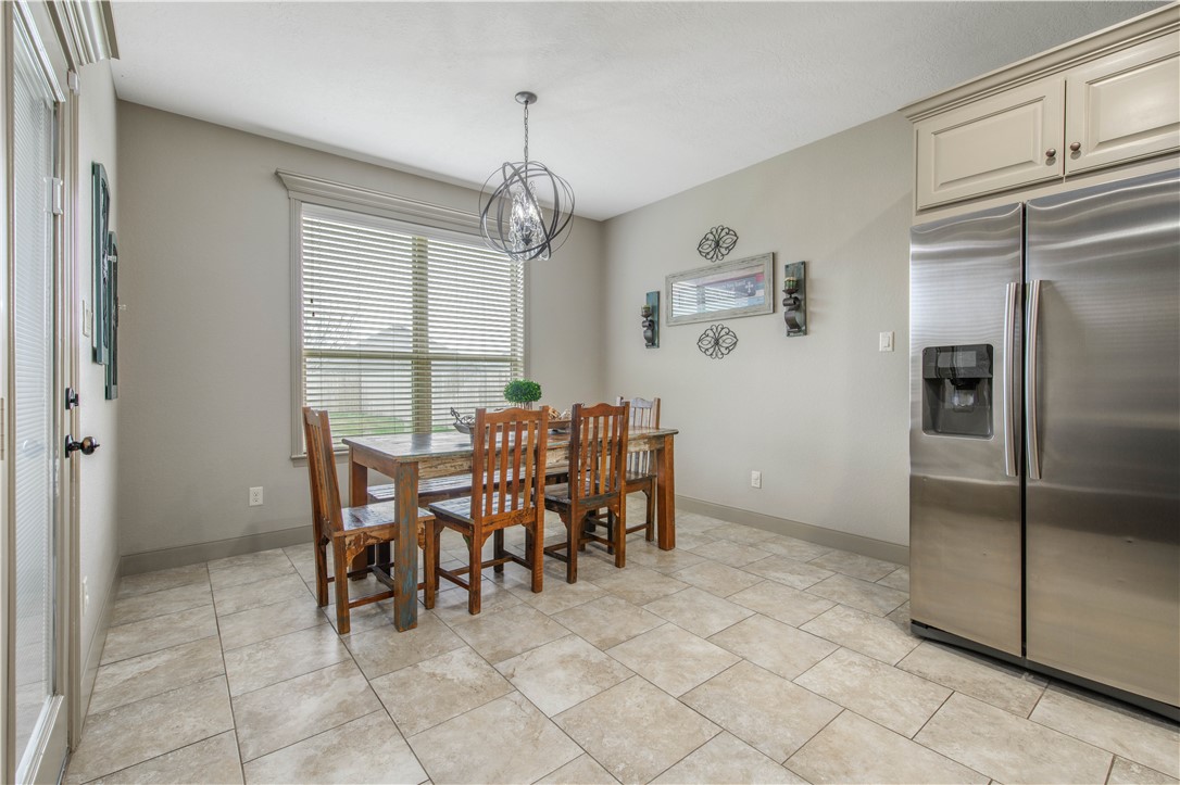 3049 Embers Loop Bryan, TX 77808 - Photo 10 of 21 a view of a dining room with furniture