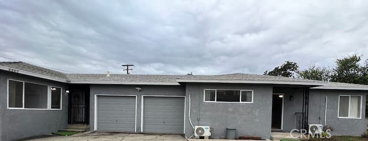 8205 Rancheria Drive Rancho Cucamonga, CA 91730 - Photo 1 of 1 a view of a house with many windows