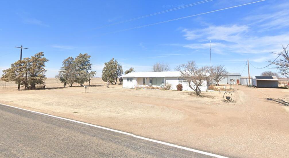 2101 Farm To Market 97 Lockney, TX 79241 - Photo 2 of 35 a view of road with a building in the background