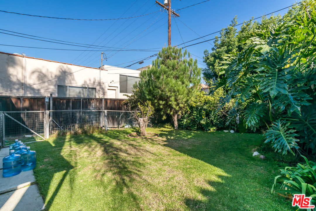 164 North Carson Road Beverly Hills, CA 90211 - Photo 3 of 5 a view of a yard with chairs and garden