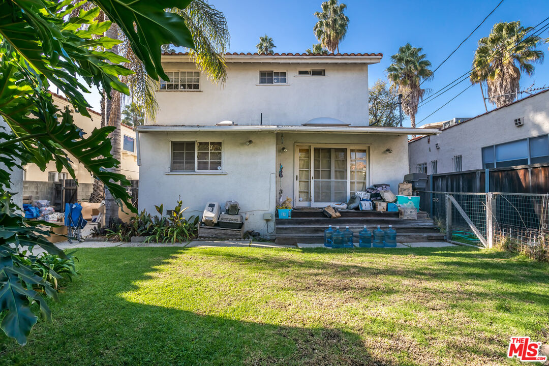 164 North Carson Road Beverly Hills, CA 90211 - Photo 5 of 5 a view of a house with swimming pool and a yard