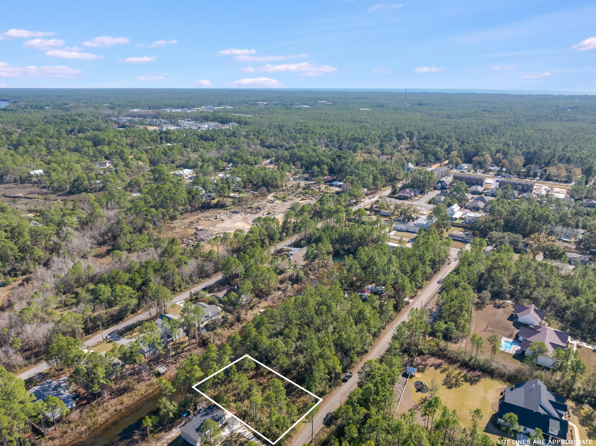 Lot 25 Rendezvous Drive Santa Rosa Beach, FL 32459 - Photo 11 of 21 an aerial view of residential houses with outdoor space and trees