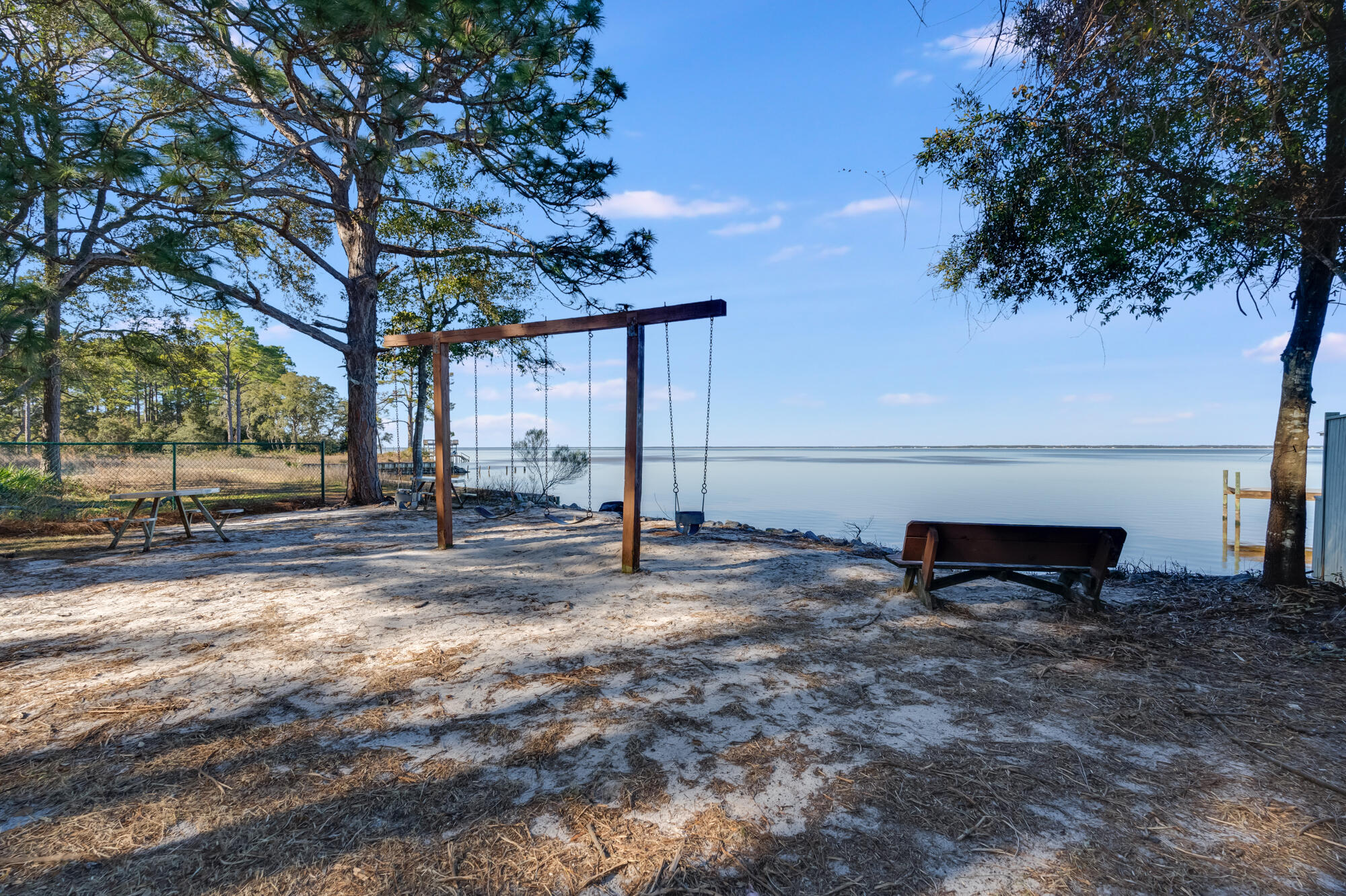Lot 25 Rendezvous Drive Santa Rosa Beach, FL 32459 - Photo 18 of 21 a view of a bench in the backyard of a house
