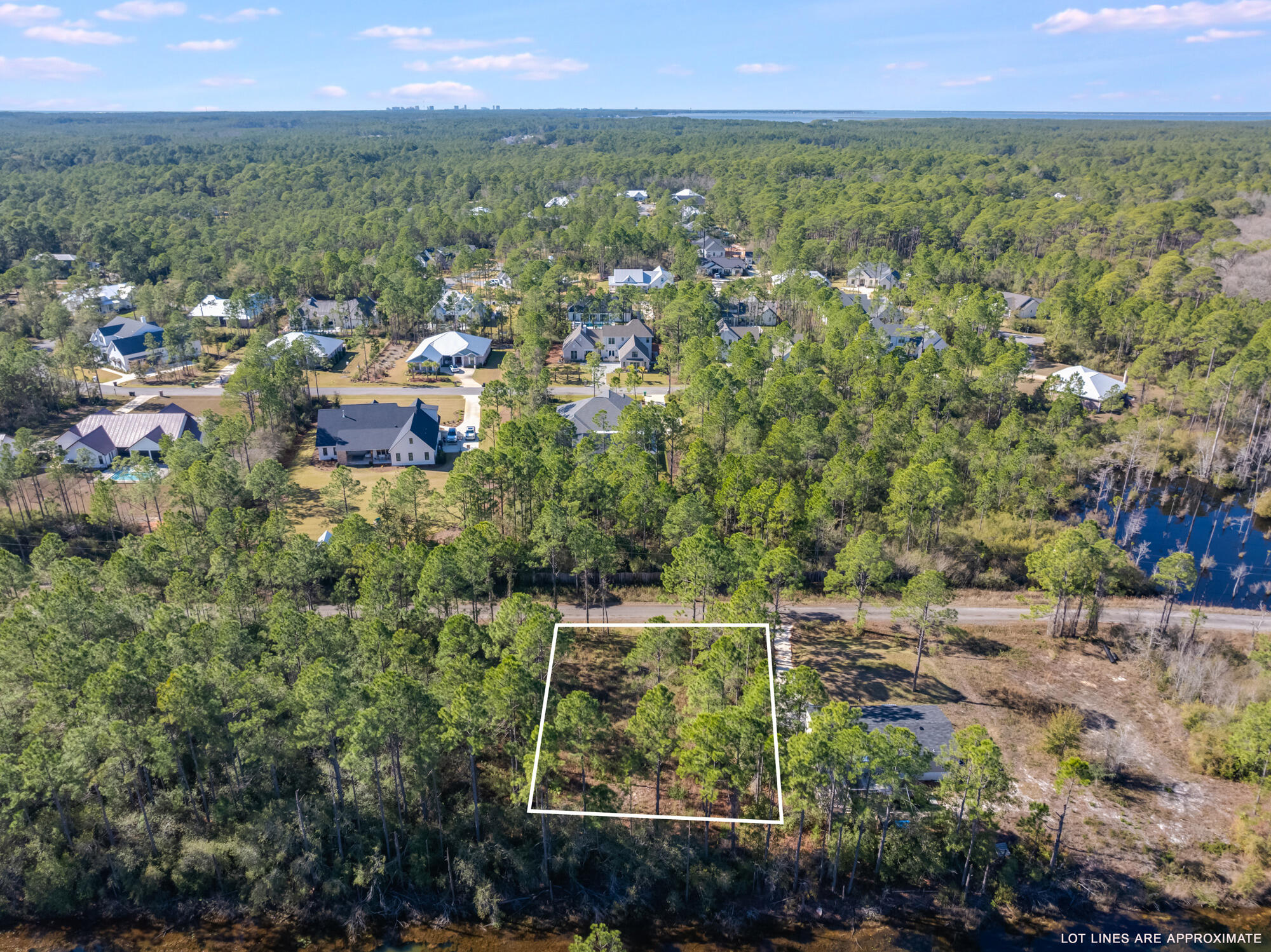 Lot 25 Rendezvous Drive Santa Rosa Beach, FL 32459 - Photo 8 of 21 a view of a city with lush green forest