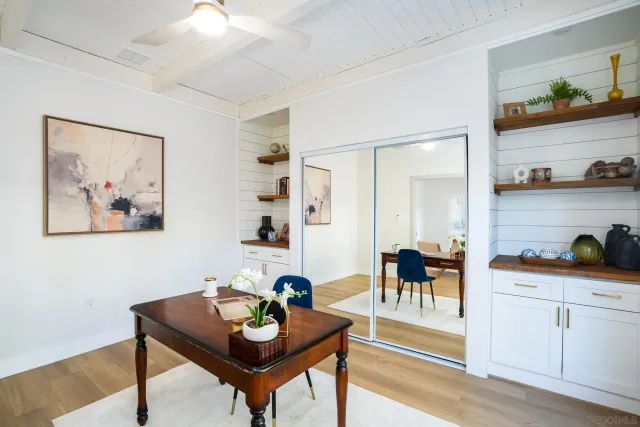 a view of a livingroom with furniture and a window