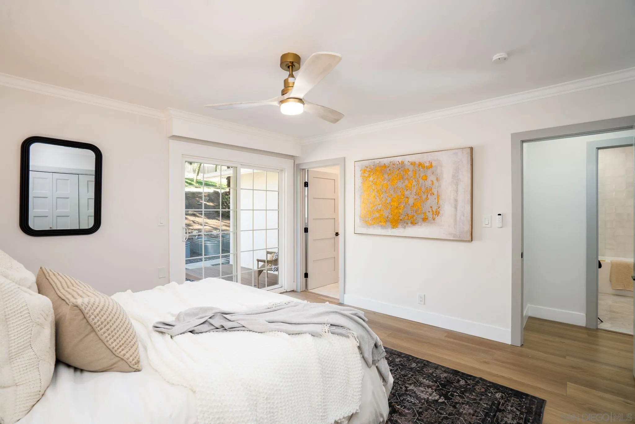 14259 Midland Road Poway, CA 92064 - Photo 19 of 60 a bedroom with a bed and a window