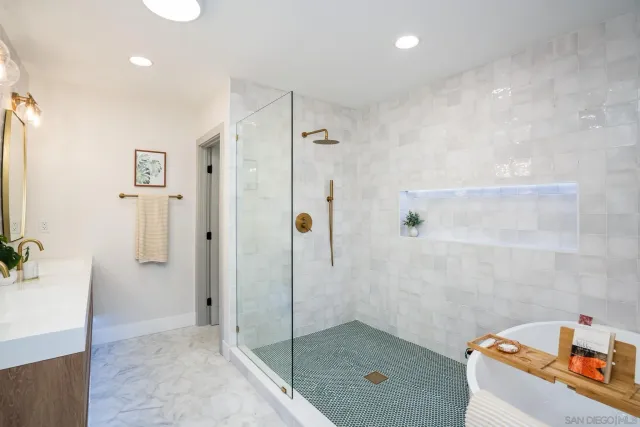 a white bath tub sitting in a bathroom