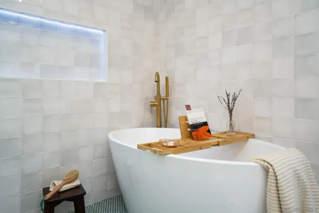 a room with a bed and a chandelier