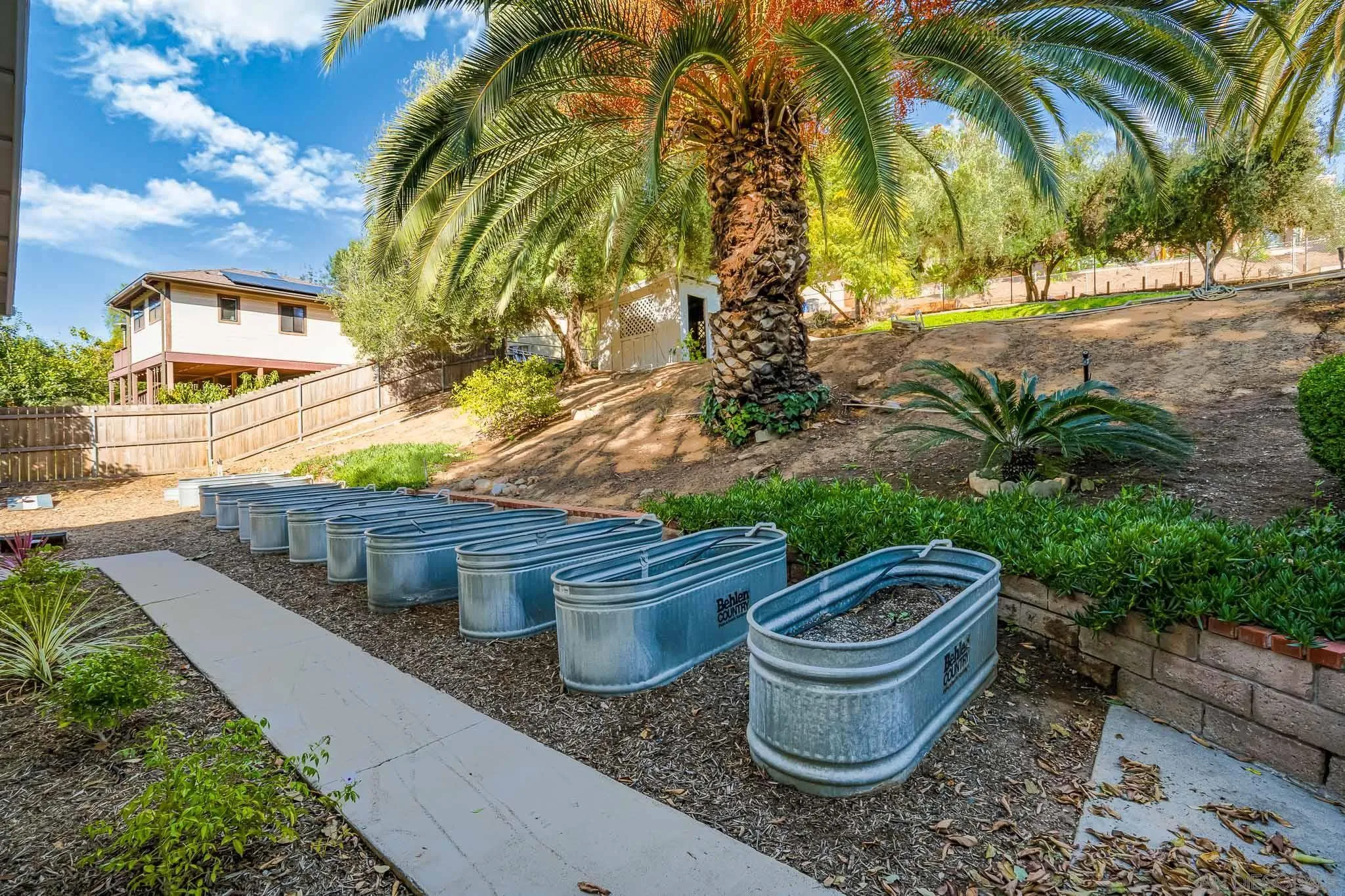 14259 Midland Road Poway, CA 92064 - Photo 33 of 60 a view of a backyard with plants and garden