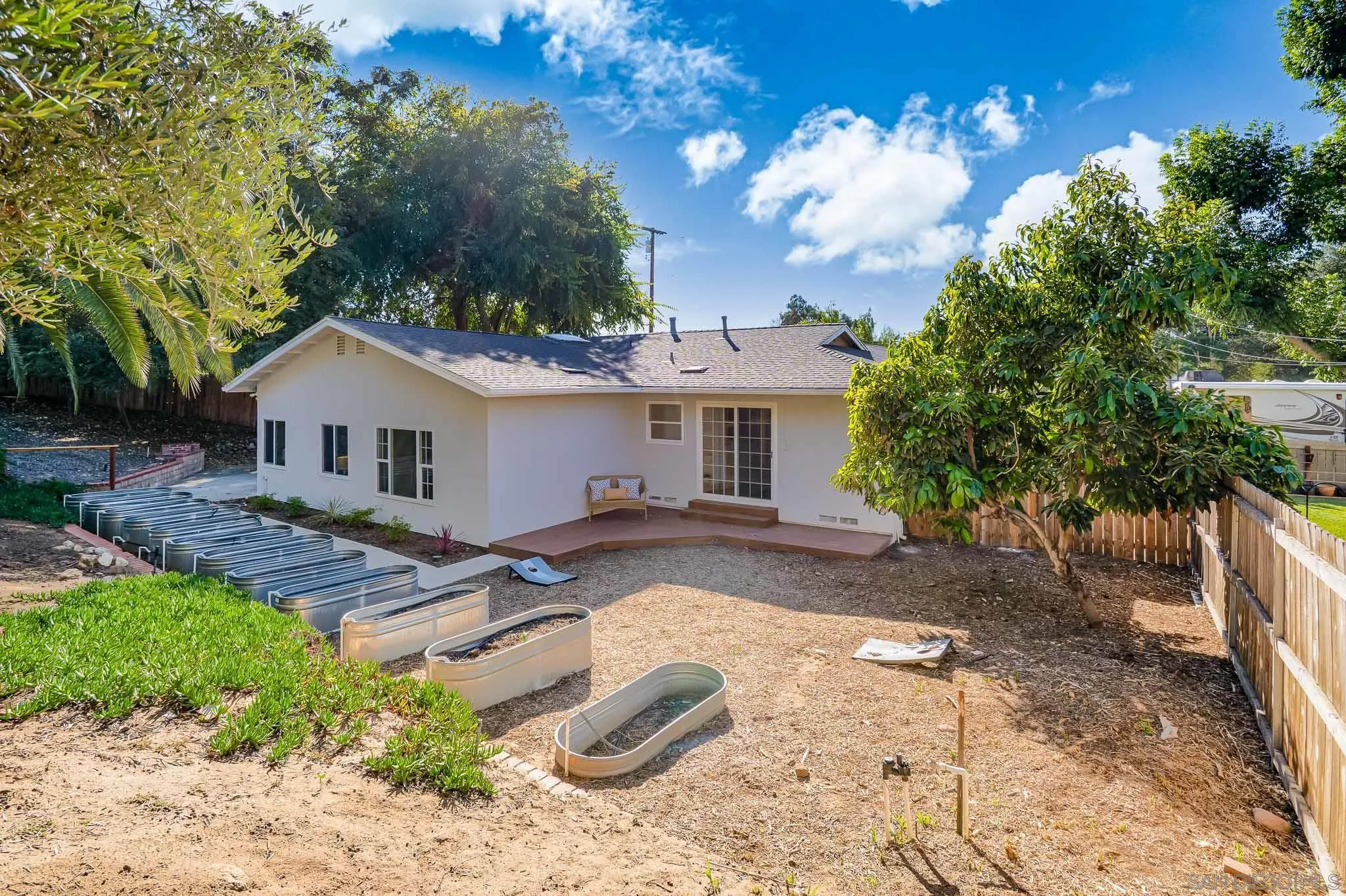 14259 Midland Road Poway, CA 92064 - Photo 35 of 60 a view of a house with backyard and sitting area