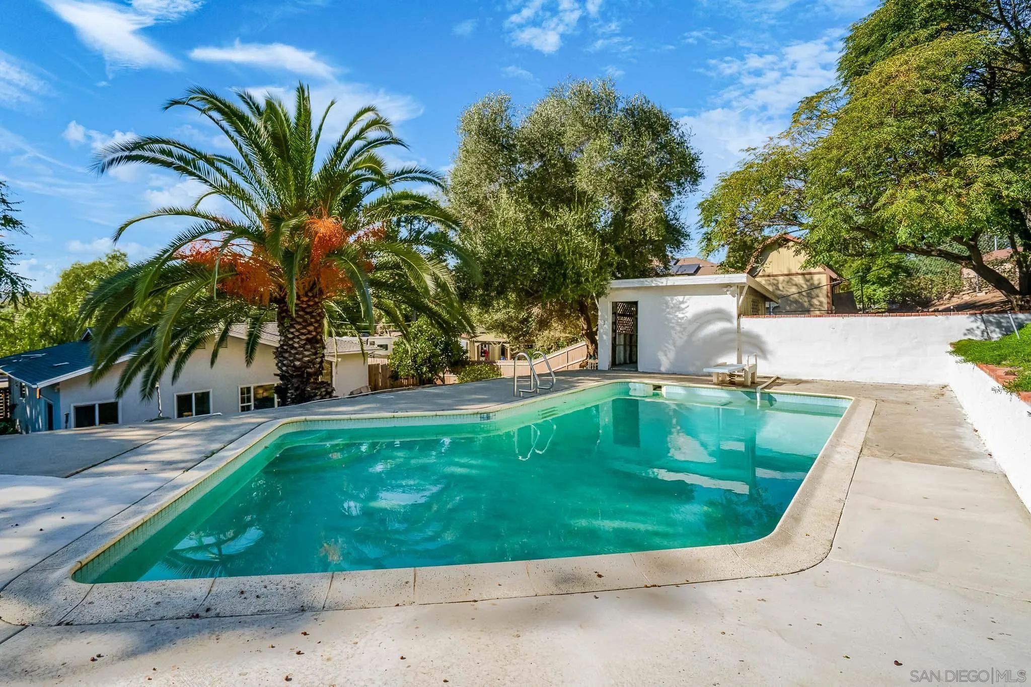14259 Midland Road Poway, CA 92064 - Photo 40 of 60 a view of a swimming pool with a yard