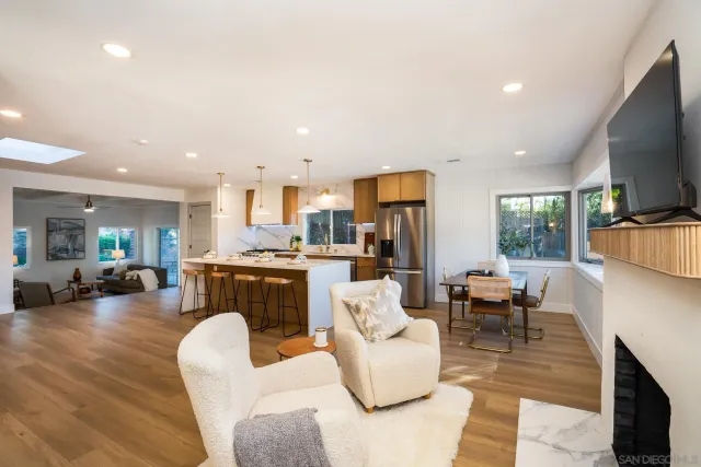a living room with fireplace furniture and a flat screen tv