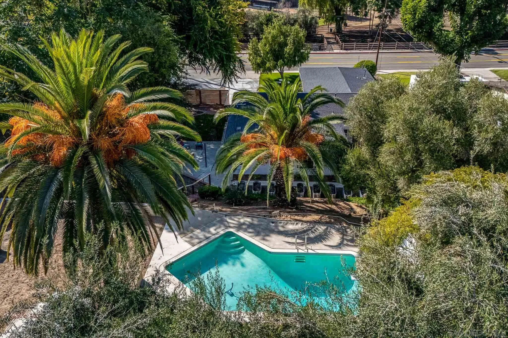 14259 Midland Road Poway, CA 92064 - Photo 55 of 60 a view of backyard with swimming pool and outdoor seating