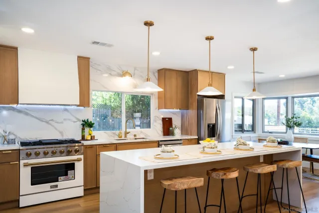 a kitchen with a sink and stove