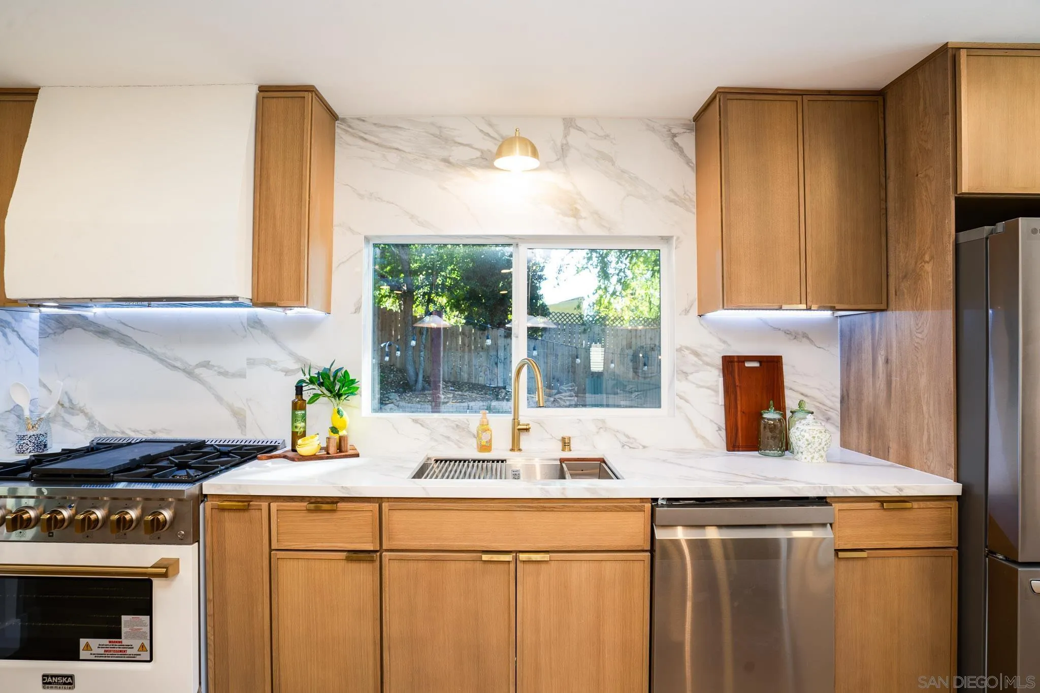 14259 Midland Road Poway, CA 92064 - Photo 8 of 60 a kitchen with a sink a counter appliances and cabinets