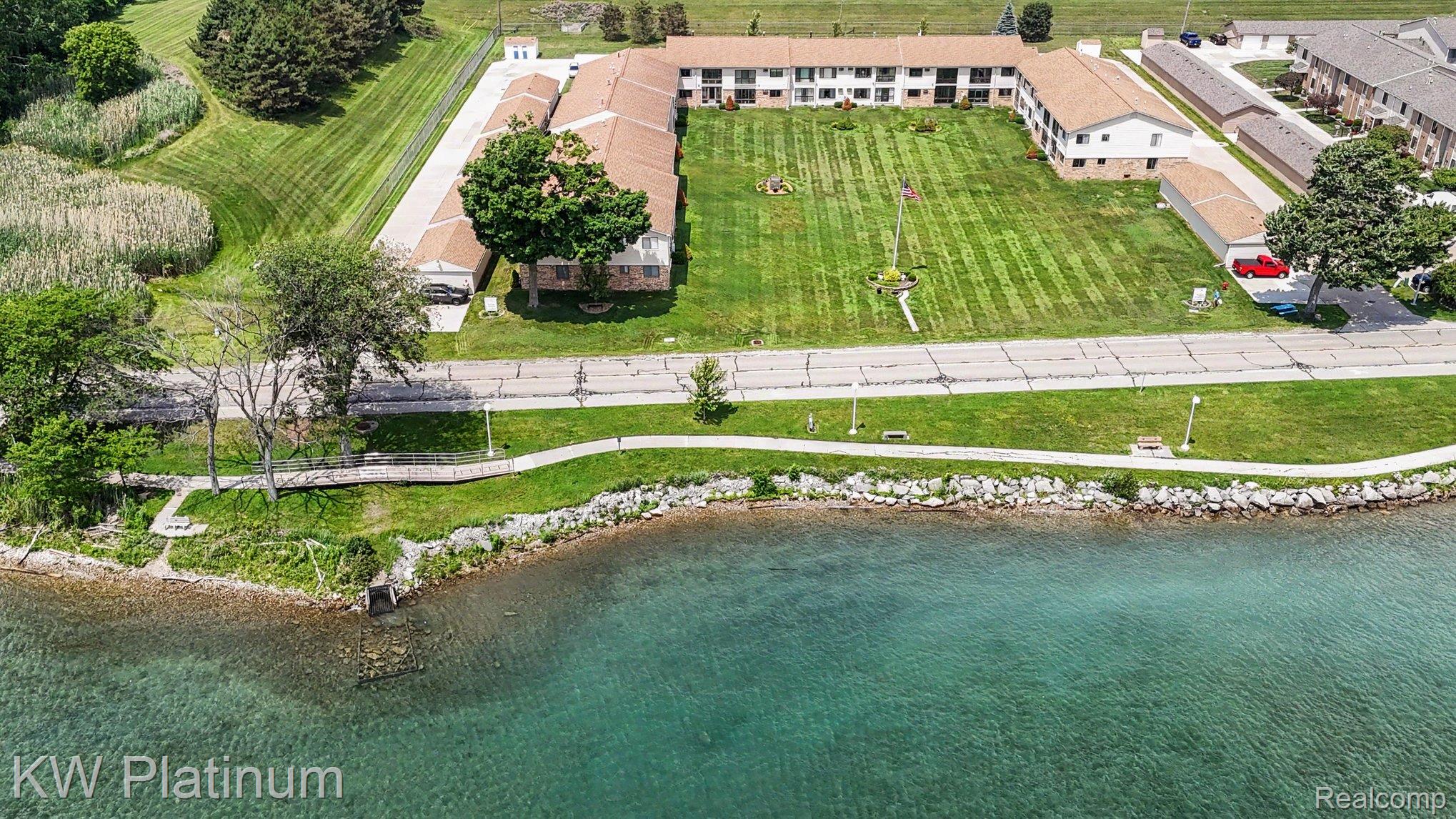 1700 River Road, Unit 6 Marysville, MI 48040 - Photo 29 of 32 Waterfront property featuring a multi-building complex with a central courtyard lawn