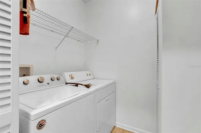a utility room with dryer and washer
