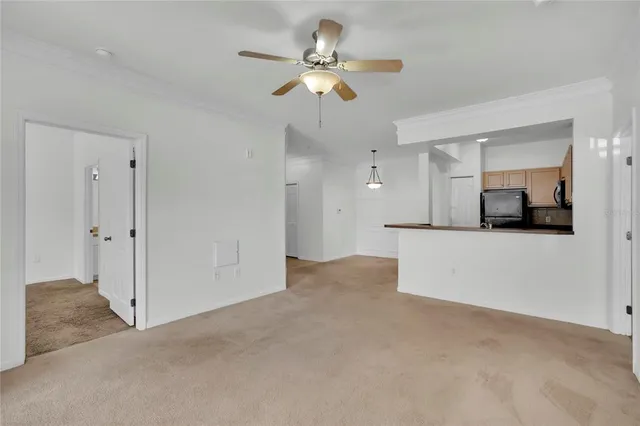 a view of a livingroom with a kitchen