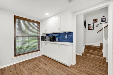 a view of kitchen and wooden floor