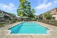 a view of a swimming pool with a patio