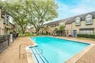 a swimming pool with outdoor seating and yard