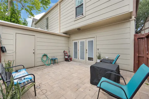 a backyard of a house with seating space