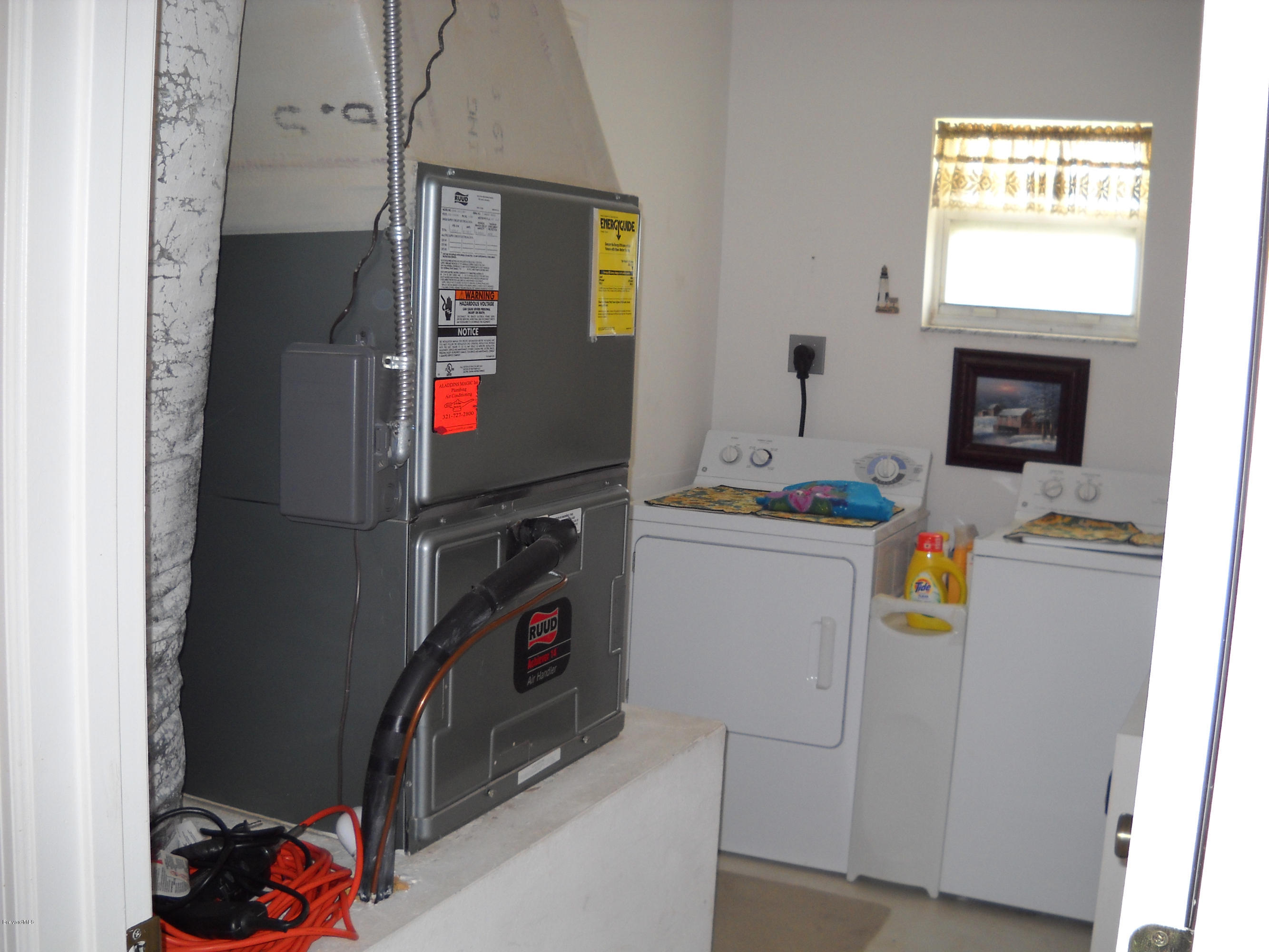 731 Schuster Road Southwest Palm Bay, FL 32908 - Photo 14 of 14 Laundry and A/C