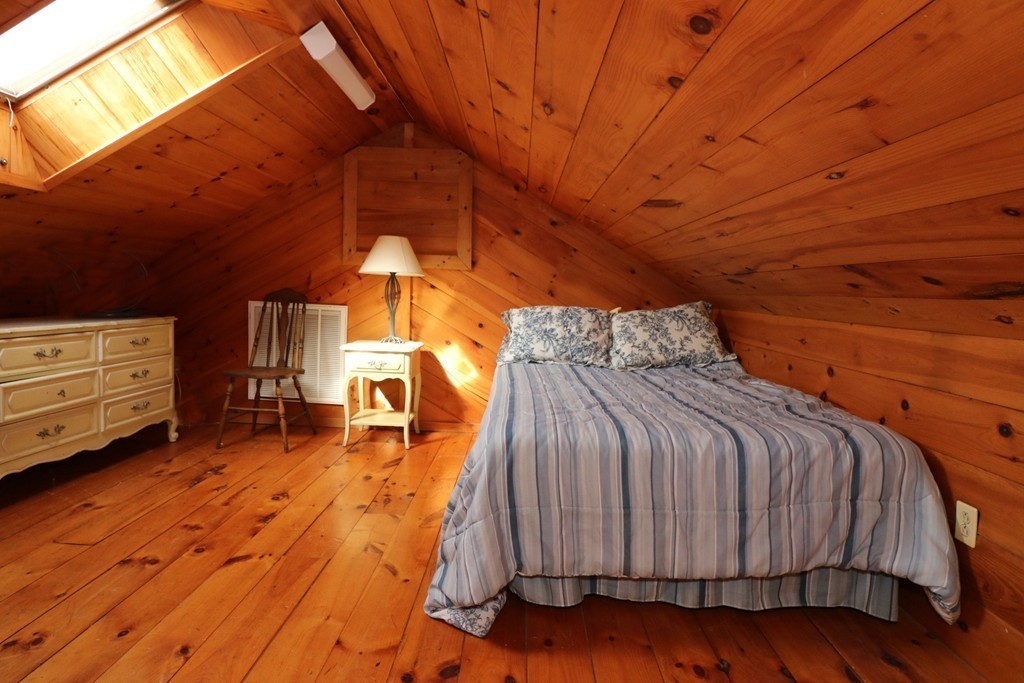 36 Ide-Ho Lane Eastham, MA 02642 - Photo 19 of 30 a bed sitting in a room next to a window