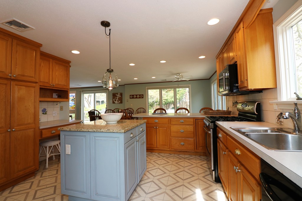 36 Ide-Ho Lane Eastham, MA 02642 - Photo 6 of 30 a kitchen with a sink a counter top space appliances and cabinets