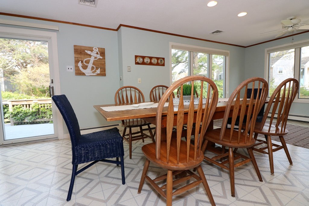 36 Ide-Ho Lane Eastham, MA 02642 - Photo 8 of 30 a view of a dining room with furniture window and outside view