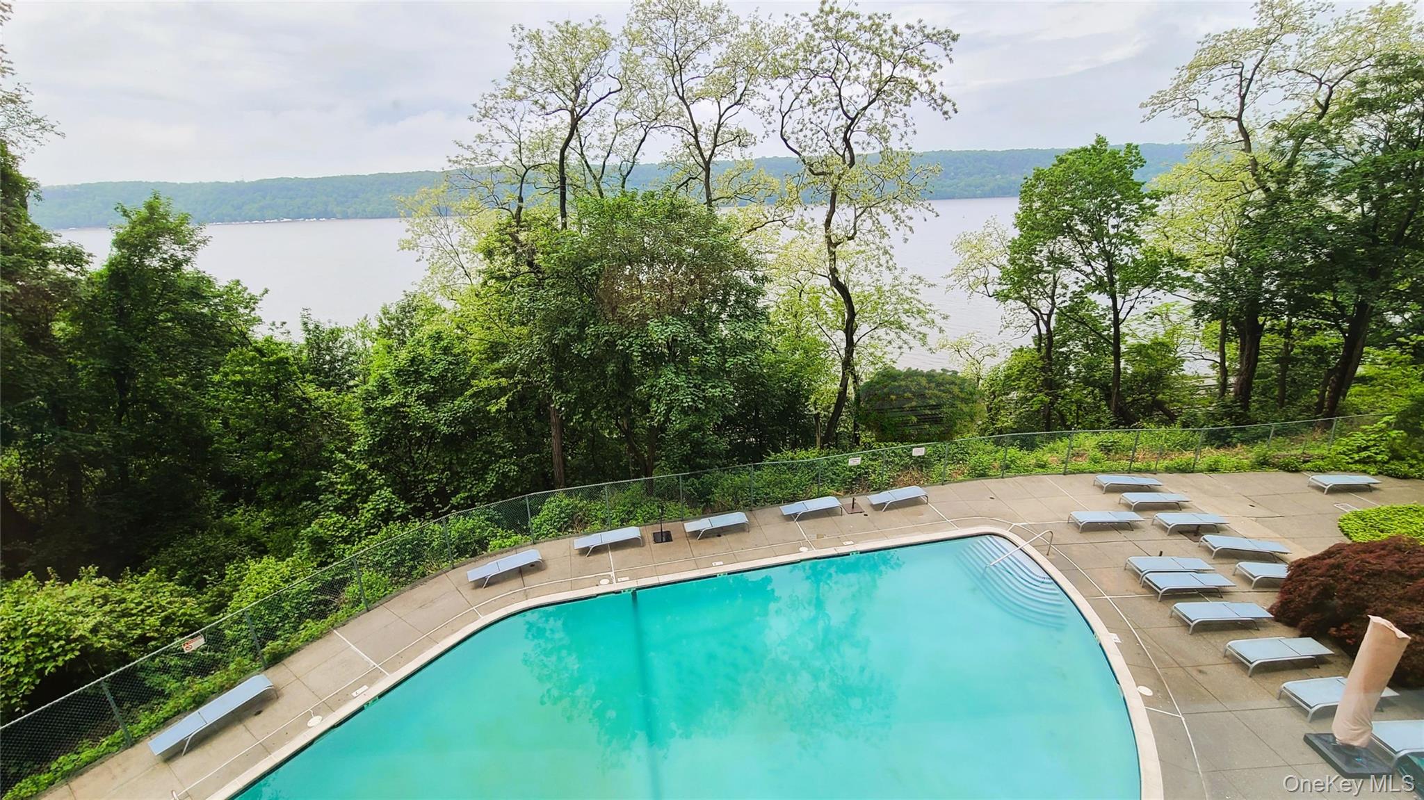 2727 Palisade Avenue, Unit 4H Bronx, NY 10463 - Photo 19 of 26 a view of a swimming pool with a yard