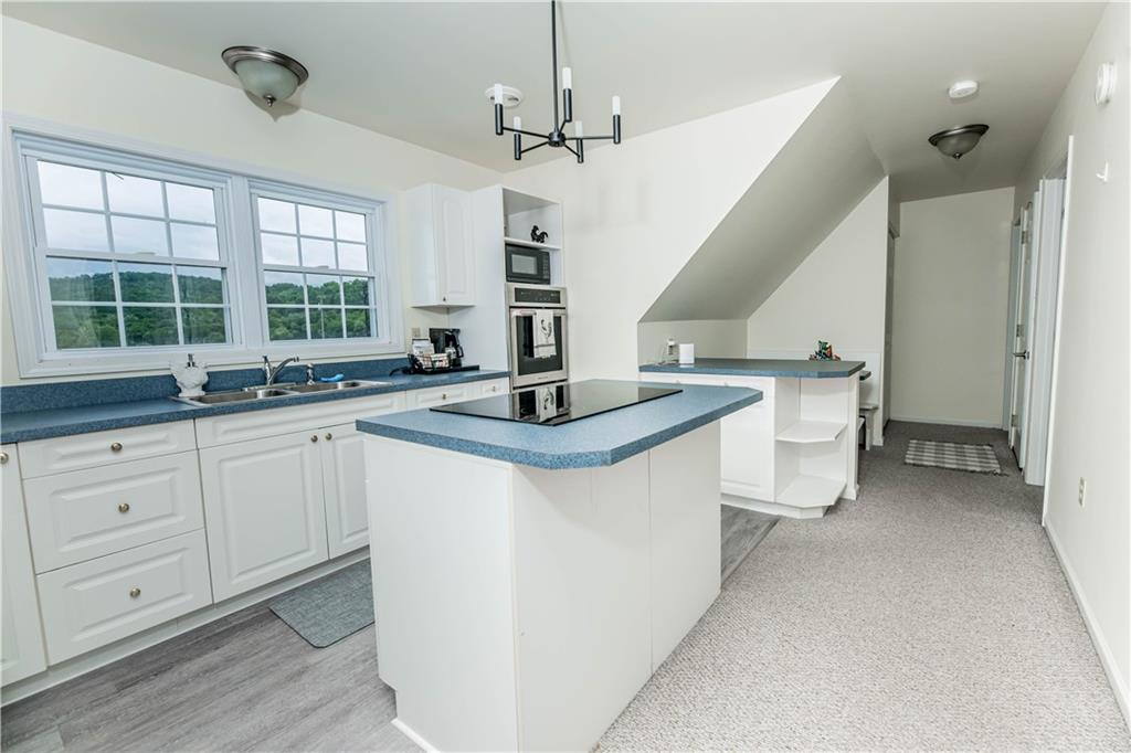 508 College Lodge Road Indiana, PA 15701 - Photo 21 of 25 a kitchen with a sink stove and cabinets