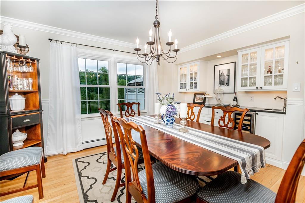 508 College Lodge Road Indiana, PA 15701 - Photo 7 of 25 a dining room with furniture a chandelier and wooden floor
