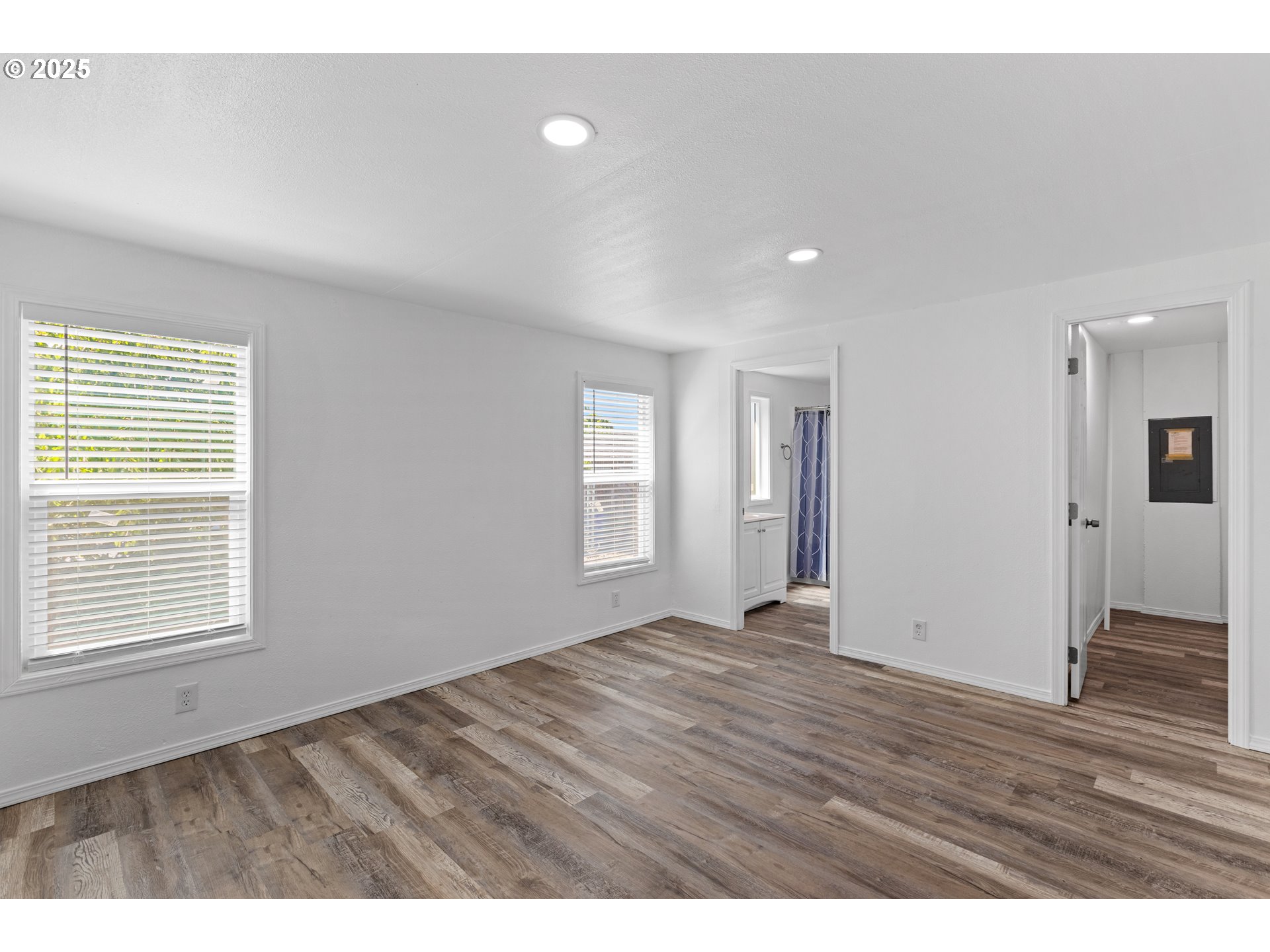 78 Manor Loop Roseburg, OR 97471 - Photo 23 of 45 a view of an empty room with wooden floor and a window