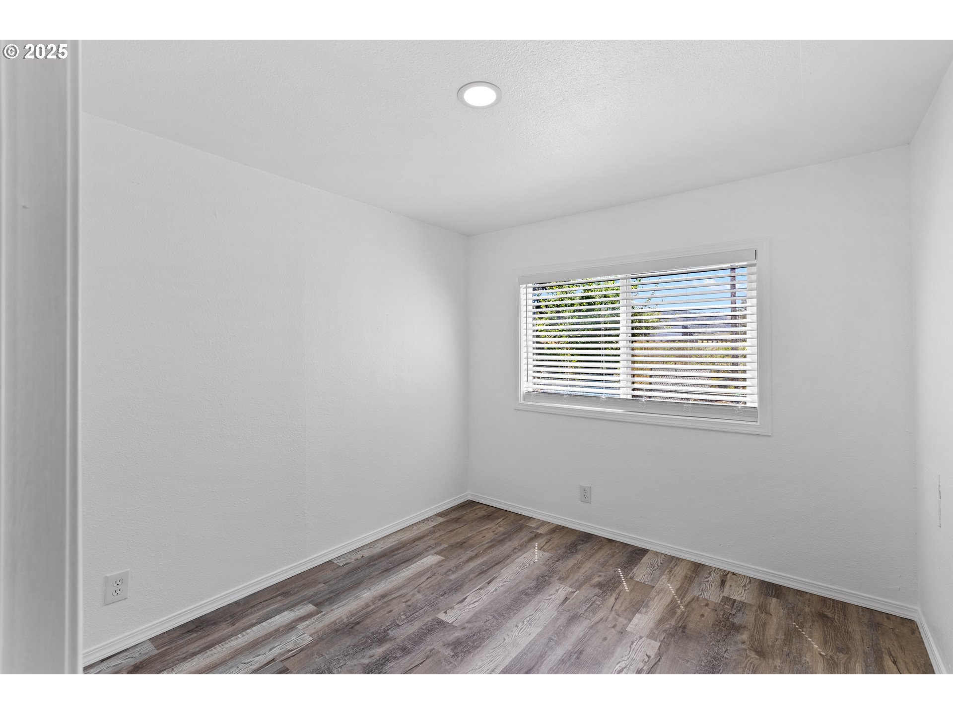 78 Manor Loop Roseburg, OR 97471 - Photo 32 of 45 a view of an empty room with wooden floor