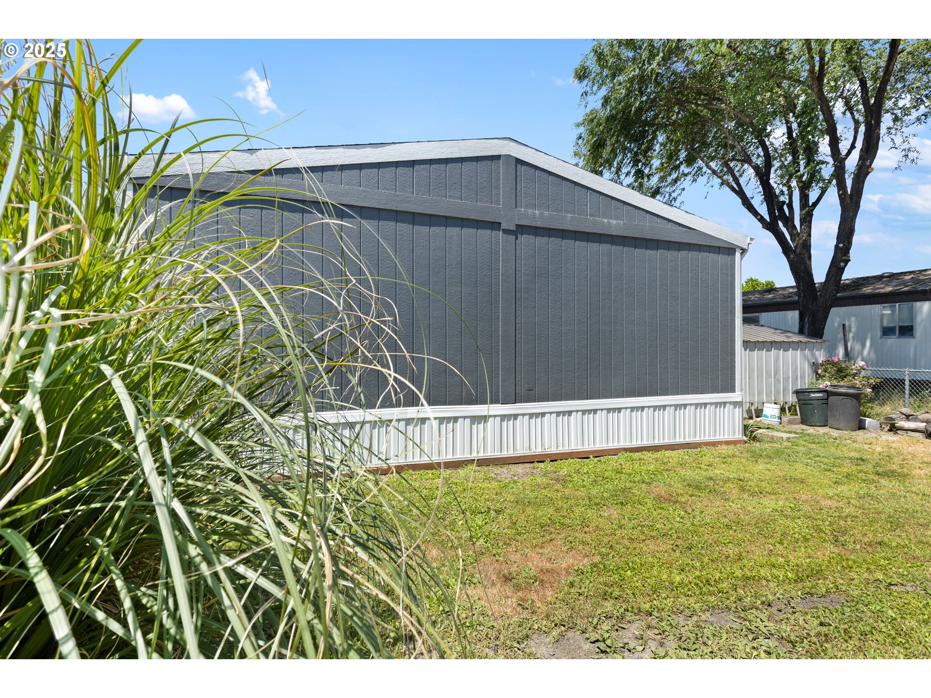 78 Manor Loop Roseburg, OR 97471 - Photo 35 of 45 a view of a backyard with a large tree
