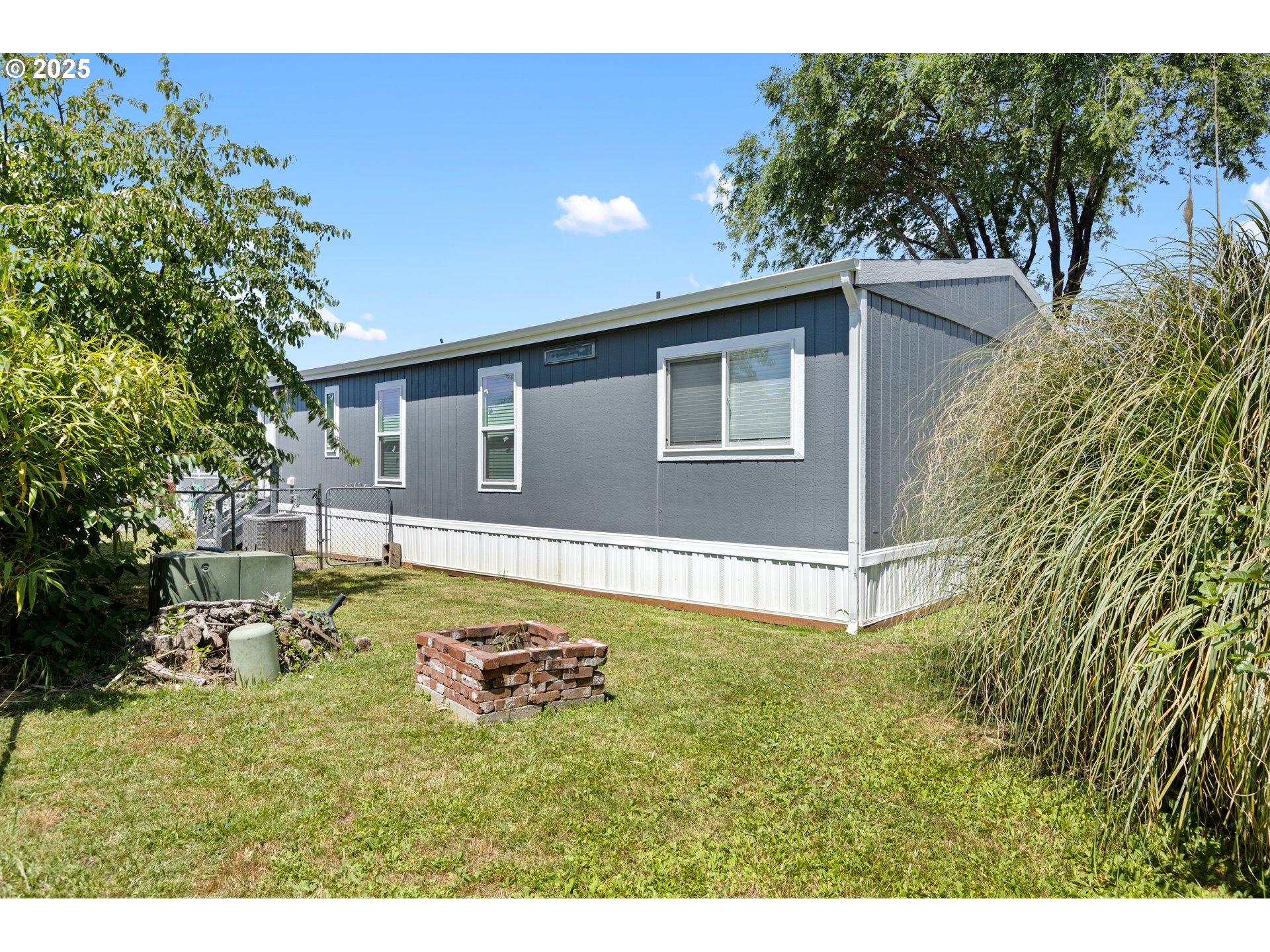 78 Manor Loop Roseburg, OR 97471 - Photo 36 of 45 a swimming pool with outdoor seating and yard