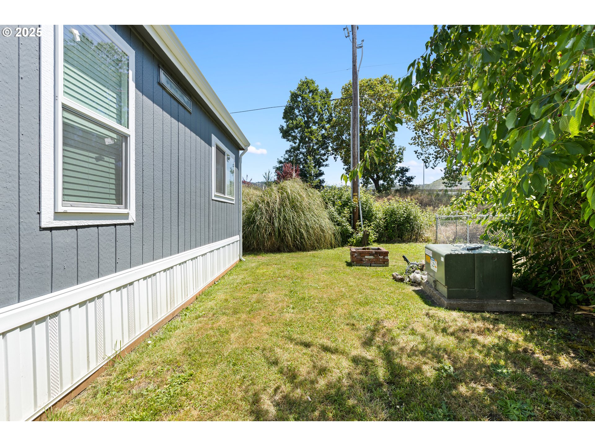 78 Manor Loop Roseburg, OR 97471 - Photo 39 of 45 a view of a backyard with pathway