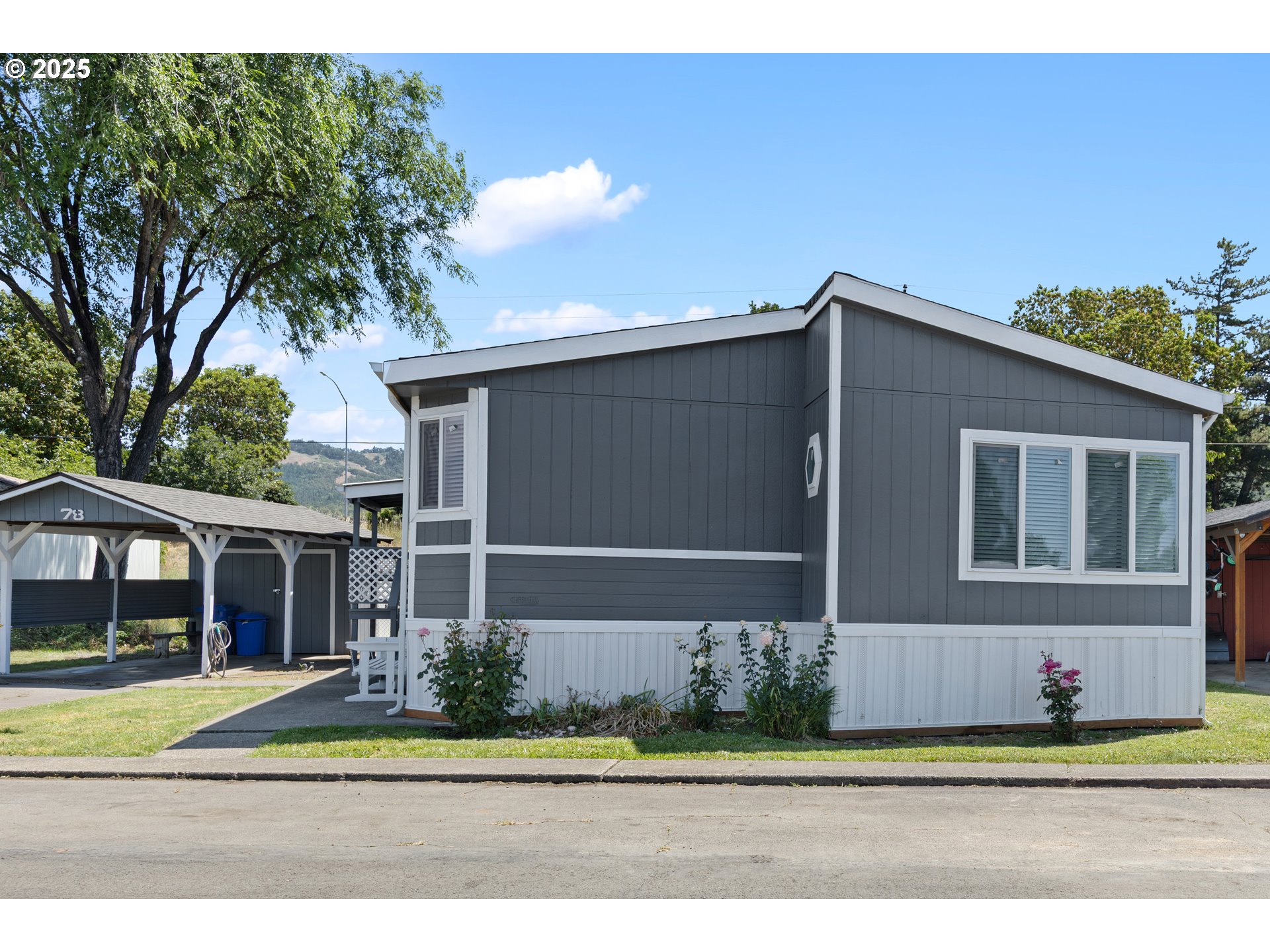 78 Manor Loop Roseburg, OR 97471 - Photo 43 of 45 a front view of a house with a garden