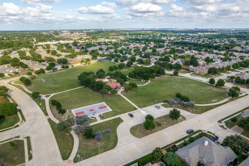 14215 Raspberry Lane Frisco, TX 75035 - Photo 29 of 30 Aerial perspective of a residential community featuring a central green space with a full-size basketball court