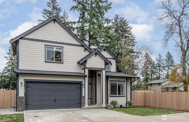 a front view of a house with garage