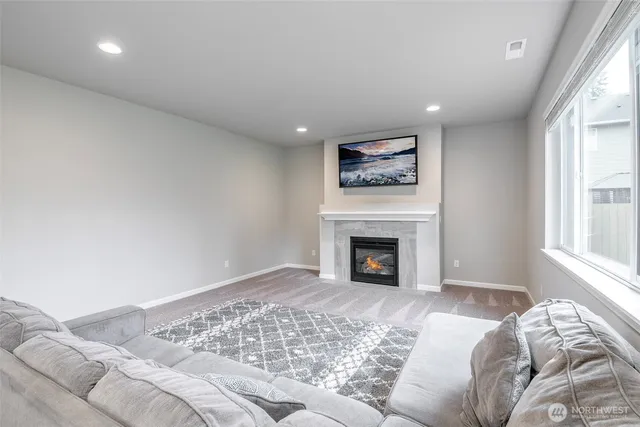 a view of bedroom with a bed and a fireplace