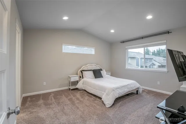 a bed room with a bed and a window