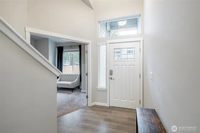 a view of livingroom with furniture and front door