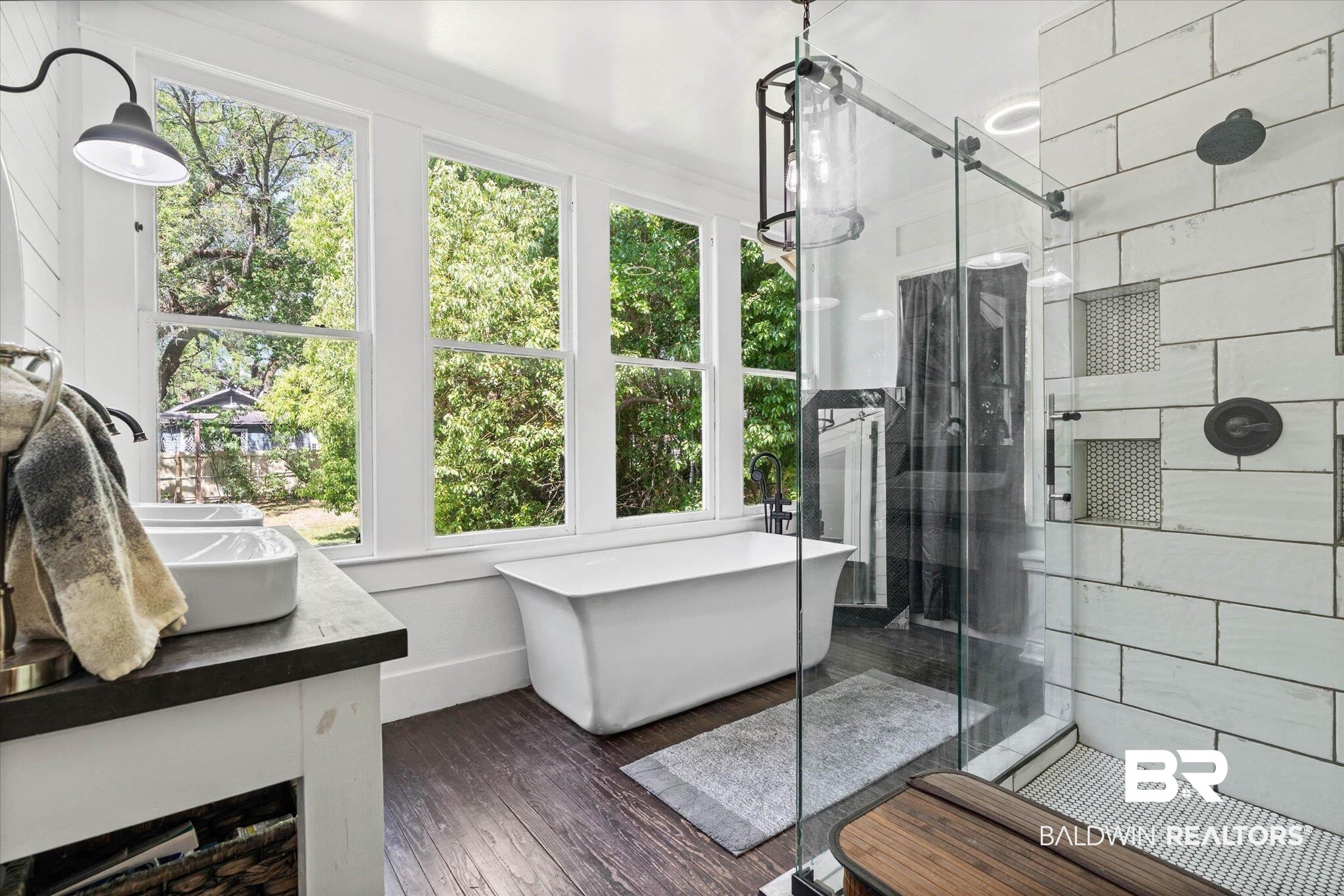 121 North Carlen Street Mobile, AL 36607 - Photo 12 of 21 Full bathroom featuring vanity, a shower stall, a soaking tub, and dark wood-style floors